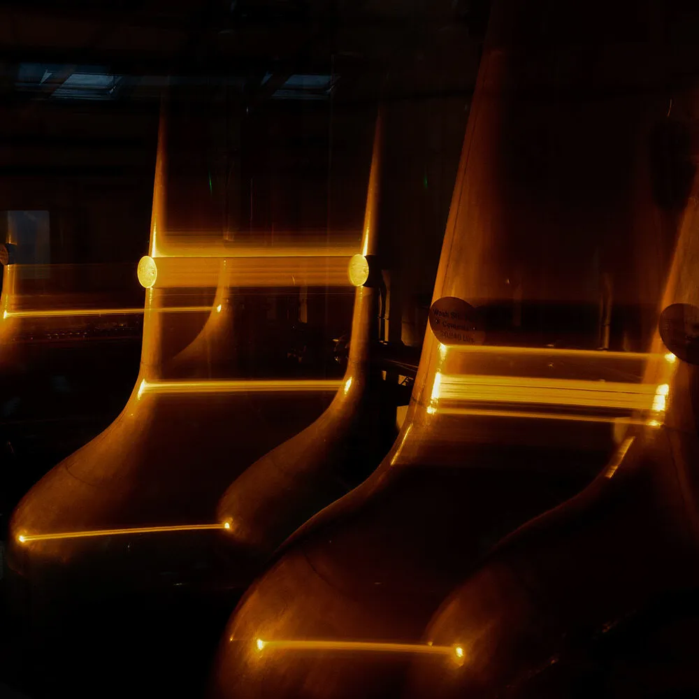 Copper distillery equipment reflecting light
