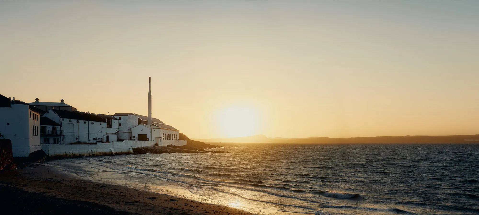 Islay distillery at a distance at dusk