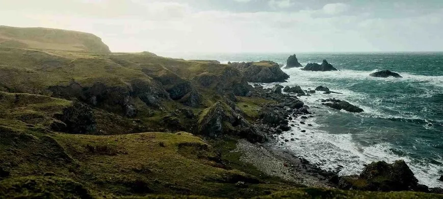 Elevated wide angle image of rocky coast and rough sea